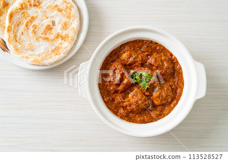 chicken tikka masala spicy curry meat food with roti or naan bread 113528527