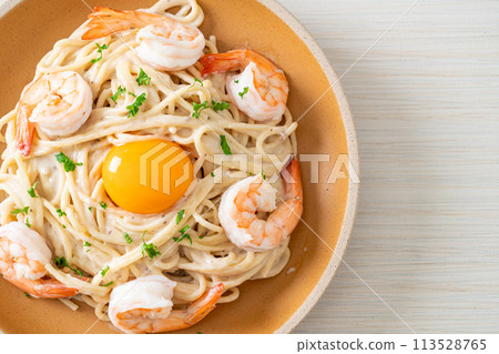 spaghetti white cream sauce with shrimps and egg yolk spaghetti white cream sauce with shrimps and egg yolk 113528765