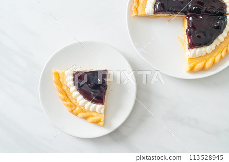 Blueberry Cheese Pie on white plate Blueberry Cheese Pie on white plate 113528945