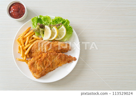 Homemade Breaded Weiner Schnitzel with Potato Chips Homemade Breaded Weiner Schnitzel with Potato Chips 113529024