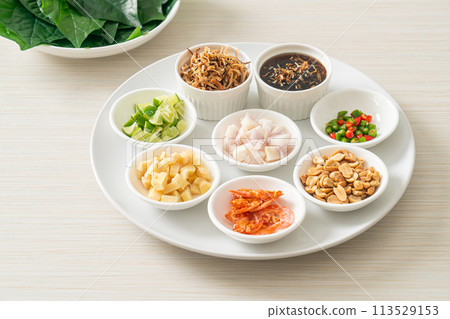 Miang kham - A royal leaf wrap appetizer Miang kham - A royal leaf wrap appetizer 113529153