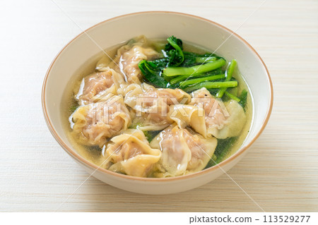 pork wonton soup or pork dumplings soup with vegetable 113529277