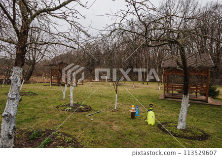 A sprays fruit trees with against pests and diseases Early spring processing A sprays fruit trees with against pests and diseases Early spring processing 113529607