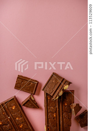 Chocolate bar pieces. Background with chocolate. Sweet food photo concept. 113529609