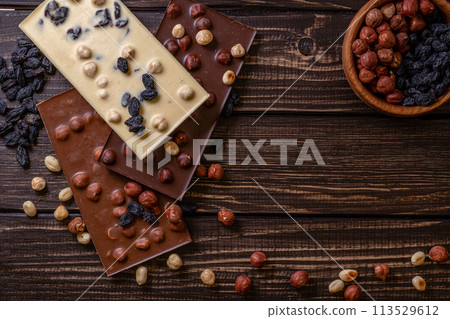 Chocolate bar pieces. Background with chocolate. Sweet food photo concept. Chocolate bar pieces. Background with chocolate. Sweet food photo concept. 113529612