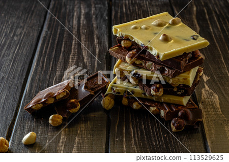 Chocolate bar pieces. Background with chocolate. Sweet food photo concept. Chocolate bar pieces. Background with chocolate. Sweet food photo concept. 113529625