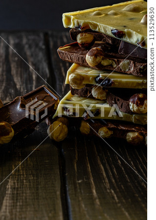 Chocolate bar pieces. Background with chocolate. Sweet food photo concept. 113529630