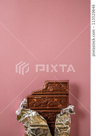 Chocolate bar pieces. Background with chocolate. Sweet food photo concept. 113529646