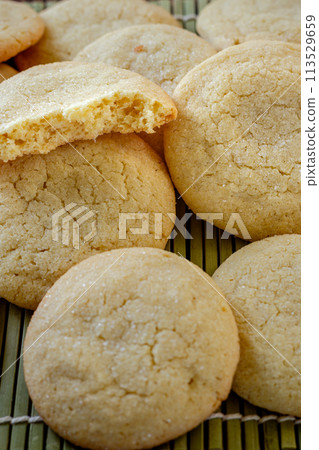 Delicious sugar cookies on wooden table, closeup Delicious sugar cookies on wooden table, closeup 113529659