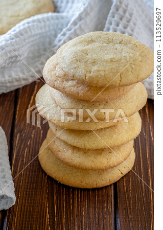 Delicious sugar cookies on wooden table, closeup Delicious sugar cookies on wooden table, closeup 113529697