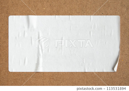 Blank white paper sticker texture on brown cardboard background Blank white paper sticker texture on brown cardboard background 113531894