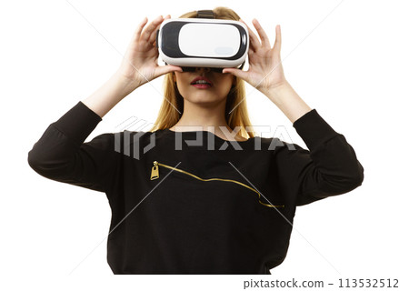 Woman wearing VR goggles 113532512