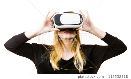 Woman wearing VR goggles 113532518