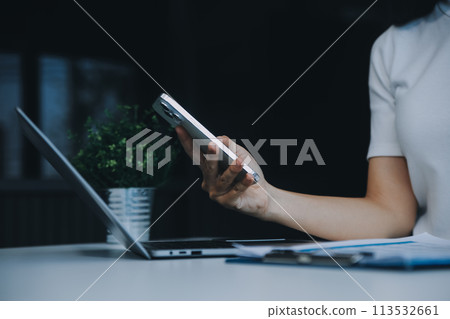 Excited happy Asian woman looking at the phone screen, celebrating an online win, overjoyed young asian female screaming with joy, isolated over a white blur background Excited happy Asian woman looking at the phone screen, celebrating an online win, overjoyed young asian female screaming with joy, isolated over a white blur background 113532661