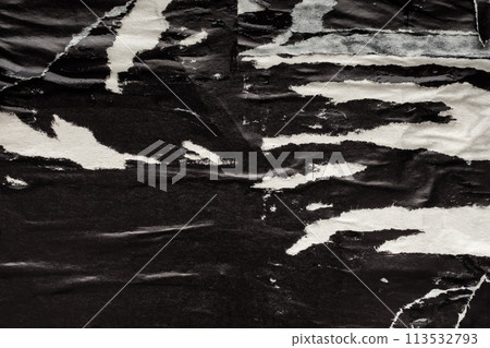 Old grunge ripped torn black paper poster surface texture background 113532793