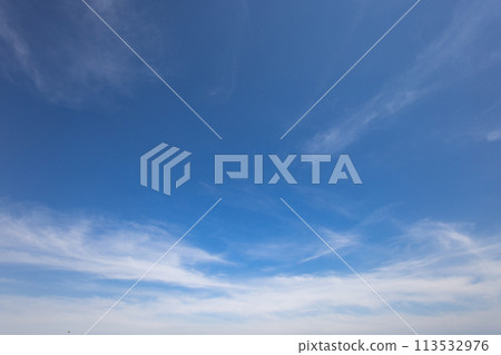 This is a picture of the calm blue sky on a sunny day and the clouds called cirrostratus (thin clouds). This is a picture of the calm blue sky on a sunny day and the clouds called cirrostratus (thin clouds). 113532976