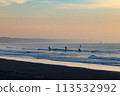 Surfers enjoying early morning surfing in Shonan. The lights in the Enoshima area are beautiful. Surfers enjoying early morning surfing in Shonan. The lights in the Enoshima area are beautiful. 113532992