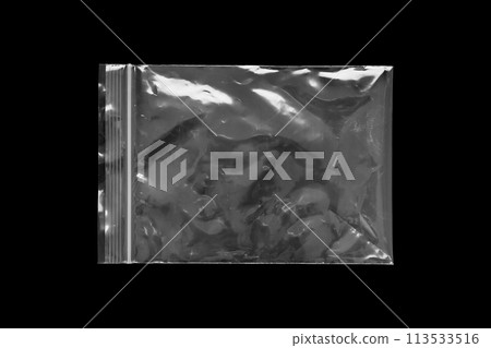 Blank transparent plastic bag overlay on black background 113533516
