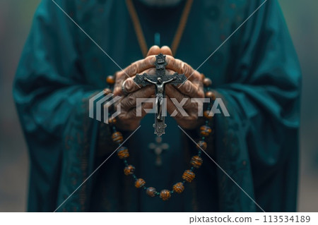 Soulful prayer: a man in quiet devotion, hands clasped around a rosary cross, seeking solace and spiritual connection, capturing the essence of serene contemplation, faith, and religious devotion. 113534189