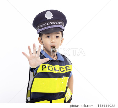 child dressed as a police officer standing and showing stop sign child dressed as a police officer standing and showing stop sign 113534988