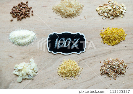 Assorted cereal grain porridge seeds set on a wooden background Assorted cereal grain porridge seeds set on a wooden background 113535327