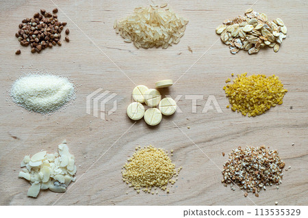 Assorted cereal grain porridge seeds set on a wooden background Assorted cereal grain porridge seeds set on a wooden background 113535329
