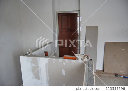 Installation of an interior door in a private house. Installation of an interior door in a private house. 113535396