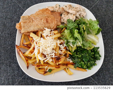 Homemade grilled chicken with grilled zucchini, green salad, french fries, cheese and parsley Homemade grilled chicken with grilled zucchini, green salad, french fries, cheese and parsley 113535629