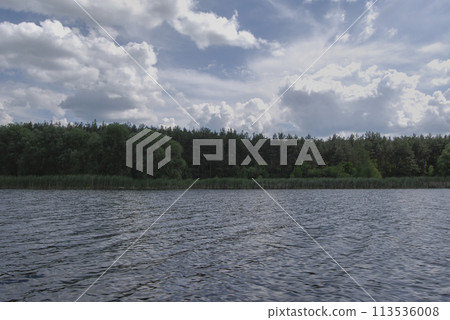 Beautiful nature in Ukraine.Beautiful landscape. The sky is in the clouds.River in Ukraine, Southern Bug, Vinnitsa region, village of Chernyatki. 113536008