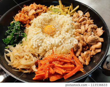 Bibimbap dish of meat, rice, vegetables and egg Bibimbap dish of meat, rice, vegetables and egg 113536633