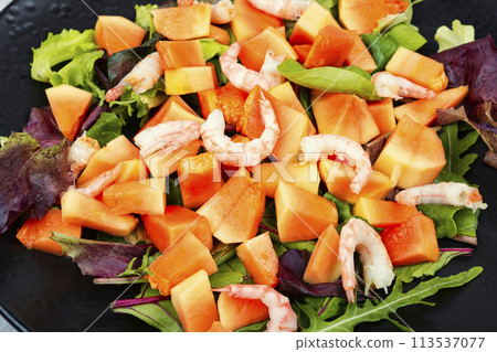 Seafood salad and papaya. 113537077
