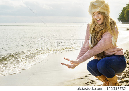 Woman on beach presenting fashion Woman on beach presenting fashion 113538782