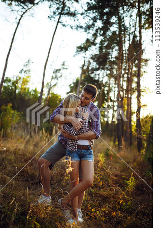Couple in love enjoying tender moments during sunset at Twin Peaks in San Francisco. 113539246