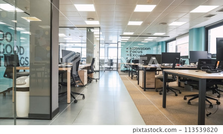 Interior of bright creative workspace with computer desks 113539820