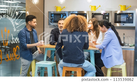 Businesspeople enjoying coffee break in canteen at office Businesspeople enjoying coffee break in canteen at office 113539862