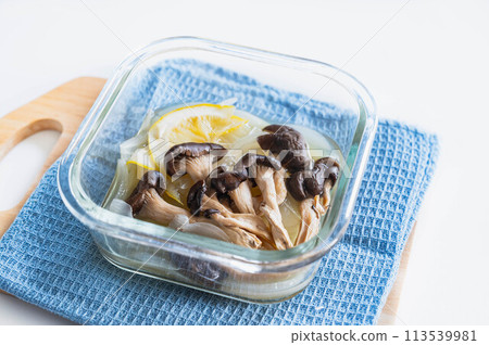 Oyster mushrooms and new onions simmered in lemon in the microwave 113539981