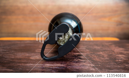 Wine bottle and bottle opener on wooden background Wine bottle and bottle opener on wooden background 113540816