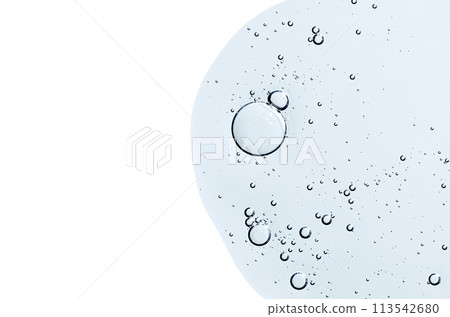 The texture of a body serum or cosmetic oil with bubbles. Liquid skin care product. Copy space. 113542680