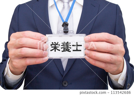 Man holding a nutritionist name tag Man holding a nutritionist name tag 113542686