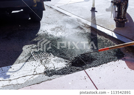 Fresh asphalt construction resurfacing bad road in city Fresh asphalt construction resurfacing bad road in city 113542891