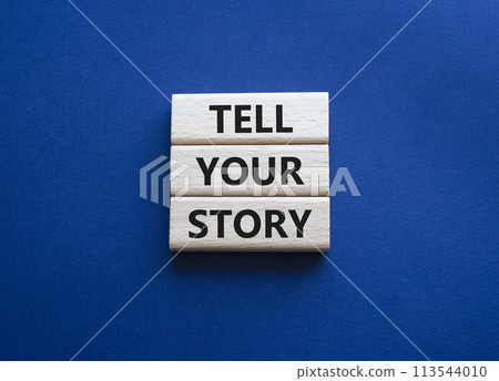 Tell your story symbol. Wooden blocks with words Tell your story. Beautiful deep blue background. Business and Tell your story concept. Copy space. 113544010