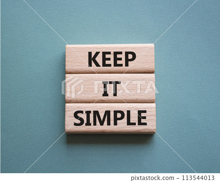 Keep it Simple symbol. Concept words Keep it Simple on wooden blocks. Beautiful grey green background. Business and Keep it Simple concept. Copy space. Keep it Simple symbol. Concept words Keep it Simple on wooden blocks. Beautiful grey green background. Business and Keep it Simple concept. Copy space. 113544013