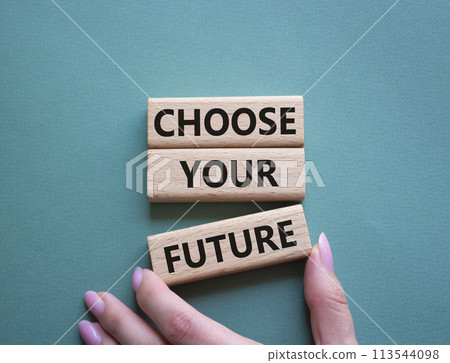 Choose your future symbol. Wooden blocks with words Choose your future. Beautiful grey green background. Businessman hand. Business and Choose your future concept. Copy space. 113544098