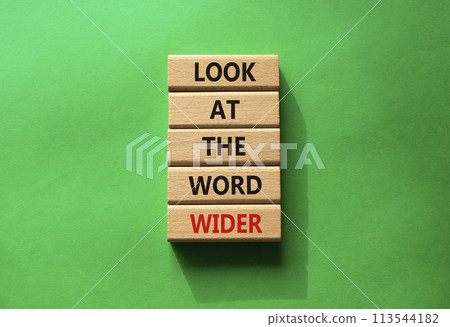 Look at the world wider symbol. Wooden blocks with words Look at the world wider. Beautiful green background. Business and Look at the world wider concept. Copy space. 113544182