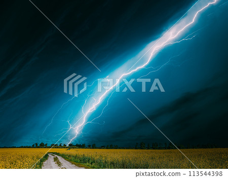 Dramatic Rain Sky With Rain Clouds On Horizon Above Rural Landscape Camola Colza Rapeseed Field. Country Road. Agricultural And Weather Forecast Concept 113544398