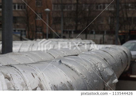 The main provides the city with hot water. Selective focus. The large pipes The main provides the city with hot water. Selective focus. The large pipes 113544426