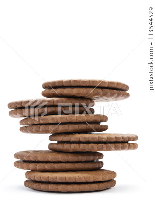 Chocolate cookies with cream filling on white background. Chocolate cookies with cream filling on white background. 113544529