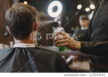 Man work with hair. Hairdresser with a client. Man work with hair. Hairdresser with a client. 113545037