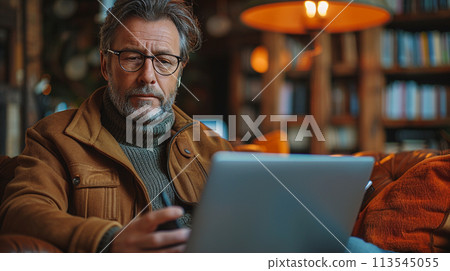 Man working using iPad on the table at the office Man working using iPad on the table at the office 113545055