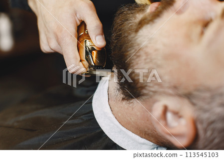 Man with a beard. Hairdresser with a client. Man with a brush. Man with a beard. Hairdresser with a client. Man with a brush. 113545103
